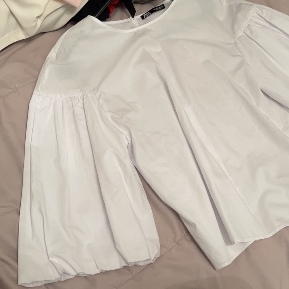 Zara’s women’s white blouse with white sleeves